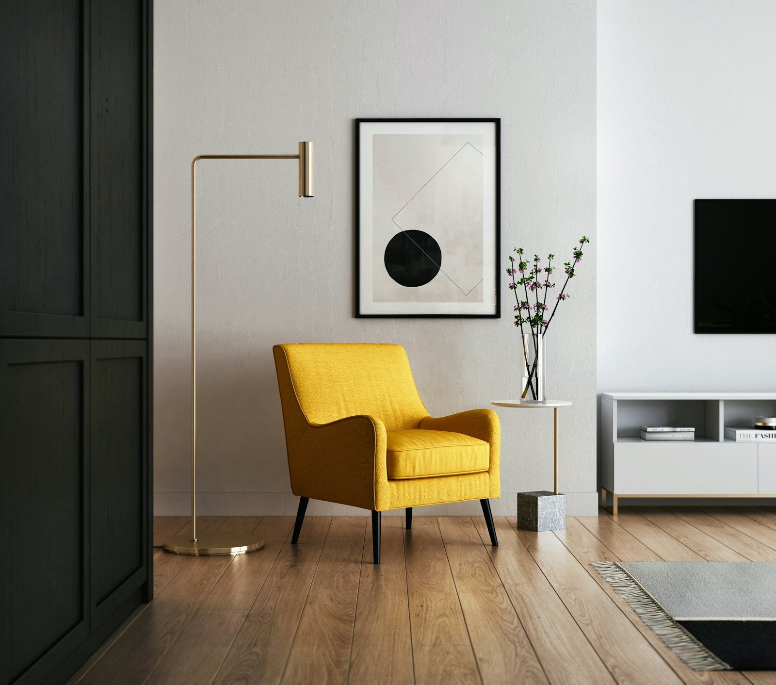A living room furnished with a sofa, cushions and a side table